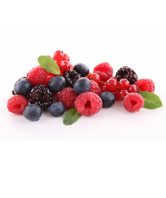 A laboratory flask of green fluid and graduated cylinder of green fluid behind a handful size of blueberries